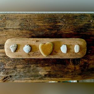 Driftwood decor with heart shaped rock and shells